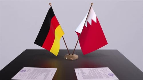 Germany and Bahrain Flags on Tabletop for Agreement