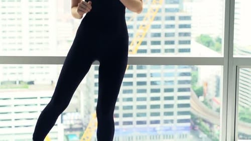 Young Woman Exercising, Stretching Legs by Window in Gym, Super