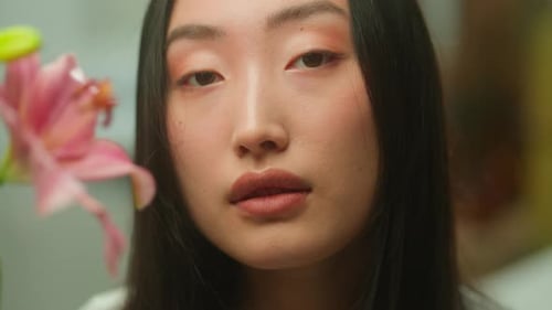 Young Adult Close Up with Pink Flower