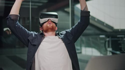 Futuristic Workflow Man Uses 3D Augmented Reality Glasses in Modern Office