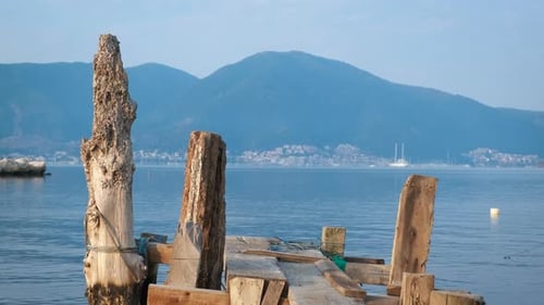 Wooden Fishing Pier Against Mountains