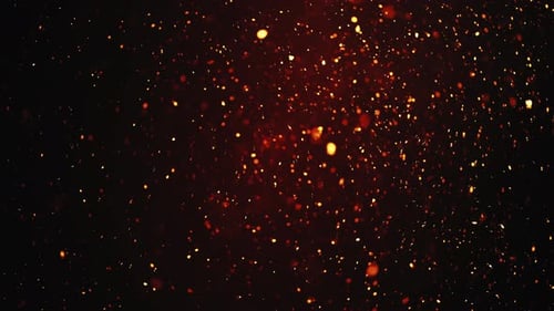 Shimmering Particles Glowing Warmly in the Dark