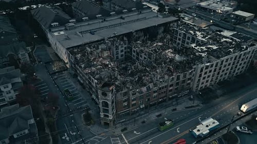 Burned down american neighborhood in Atlanta City. Skyline with Skyscraper Silhouette in background.