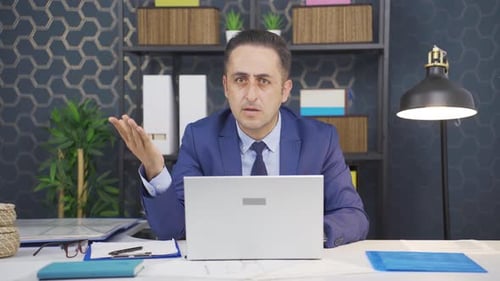 Frustrated Businessman in Office Experiencing Workplace Stress