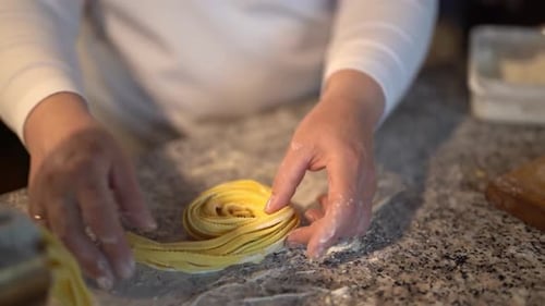 Crop Chef Making Noodle Rolls in Restaurant