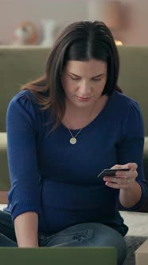 Woman Uses Credit Card with Laptop