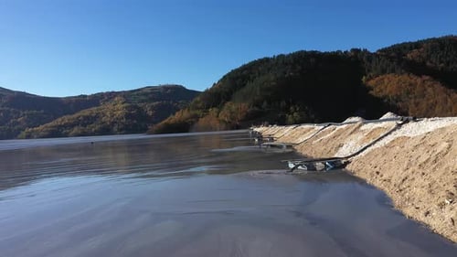 Aerial View of Mining Residuals Flowing into Decanting Pond from a Copper mine. Geamana, Rosia Monta