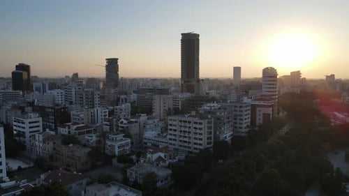 Aerial view of the evening city from above. High-rise building and urban development.