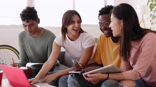 Young Group of University Students Working Together Using Laptop at Home
