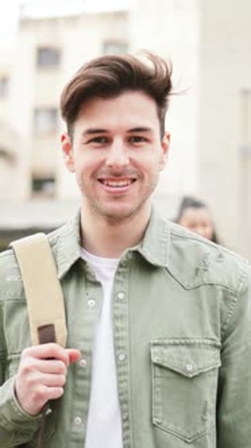 Young Adult Smiling with Backpack in City