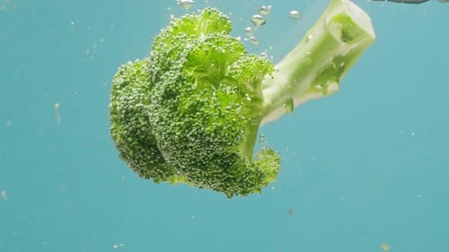 Green Broccoli Falling in Boiling Water Fresh Fruits and Vegetables Falling Splashing Into Water