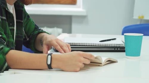Focused Student Diligently Extracts Key Insights From a Book