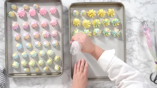 Step By Step Flat Lay Piping Unicorn Meringue Cookies to the Baking Sheet Lined with a Parchment