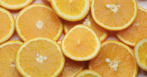 Top Down Background View Made of Fresh Sliced Organic Oranges Closeup
