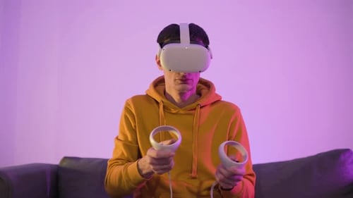 Young Adult Immersed in Virtual Reality Gaming
