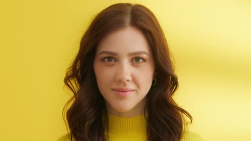 Serious Girl Posing on Camera in Studio Pretty Woman Blinking Eyes