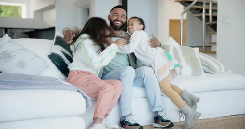 Happy Father Receives Affectionate Hug From Two Daughters