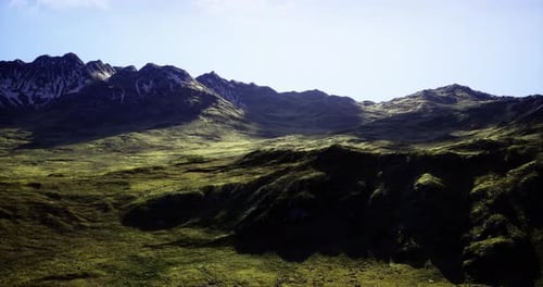 Majestic Mountain Landscape Under Clear Blue Sky on Sunny Day