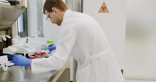 Man Working in Brightly Lit Medical Research Lab