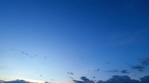 Dark Clouds Pass in Blue Twilight Sky
