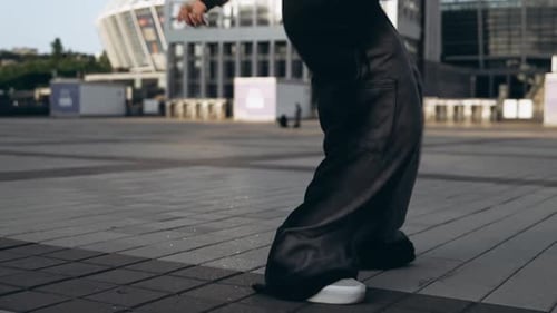 Young Woman Dancing Hip Hop on the Street
