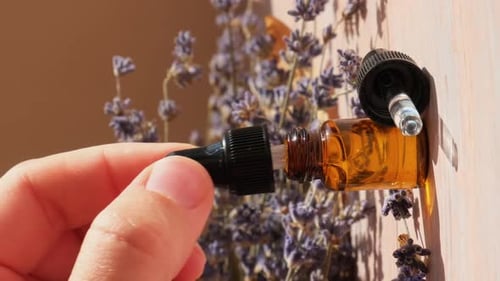 Dropper Bottle with Lavender Flowers Close Up