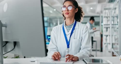 Female Scientist Works in Modern Laboratory