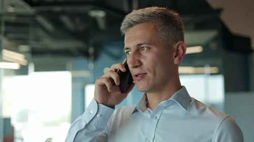 Businessman Having a Phone Call at the Office