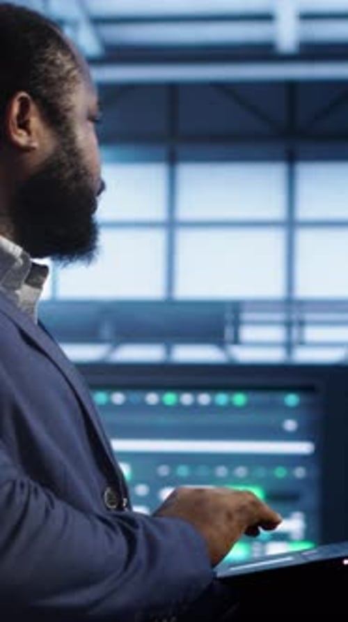 Vertical Video Data Center Worker Fixing Errors Affecting Supercomputers