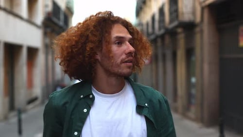 Smiling Young Adult with Curly Hair Close Up