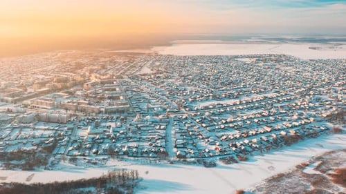 Aerial View Of Town Village Cityscape Skyline In Winter Sunny Morning Sunrise Timelapse Dronelapse