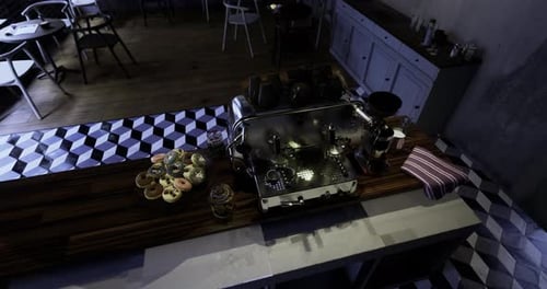 Brightly Lit Cafe Counter Featuring Espresso Machine and Pastries on Display