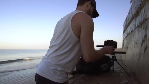 Photographer Sets Up Camera For Photo Shoot. Bang Niang Beach, Khao Lak, Thailand