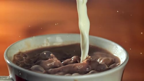 Hot Chocolate is Poured Into a Mug Filmed on a Highspeed Camera at 1000 Fps