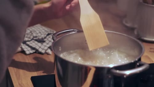 Stirring Food in a Pot on the Stove