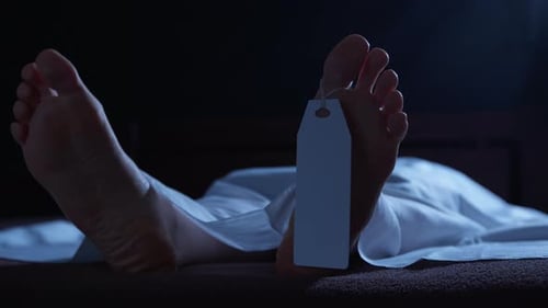 Deceased Person's Feet with Tag in Hospital Morgue