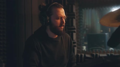 Male Musician Plays a Drum Kit in Sound Recording Studio