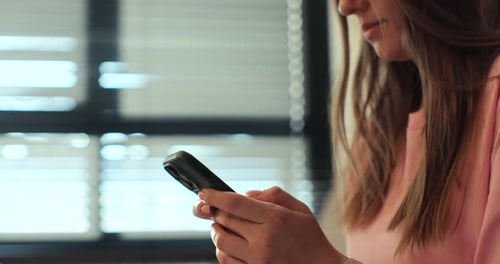 Hand of Woman Using Texting Mobile Phone or Chat Close Up of Woman Hand Sunlight