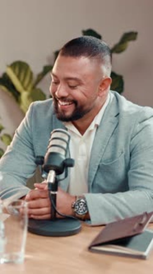 Business, podcast and man in studio, smile and microphone with financial advisor, radio and talk