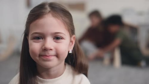 Smiling Child Portrait with Friends in Background