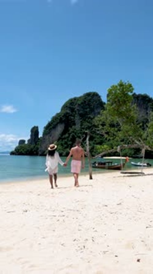 Couple Men and Women on a Tropical White Beach in Thailand Koh Hong Island Krabi