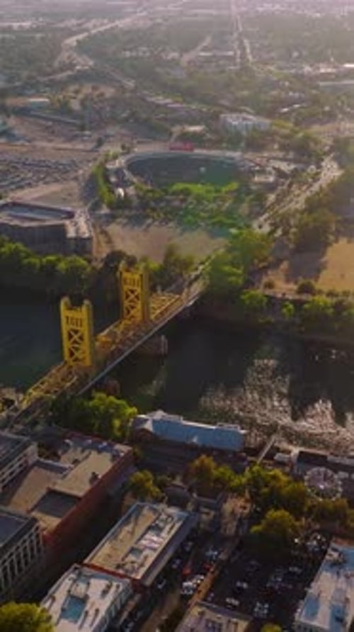 Amazing Sacramento on beautiful sunny daytime. Sacramento River crossing the lively urban city.