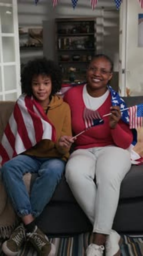 Boy and Woman Celebrate Fourth of July at Home