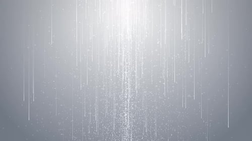 Abstrakter Regen von Glitzerpartikeln auf sauberem weißgrauem Hintergrund. Strahlende Partikel und wunderschön