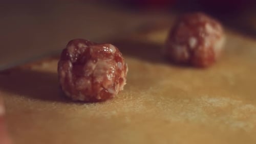 Close Up of Raw Meatballs on Board