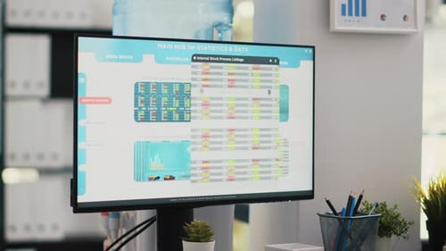 Stock Market Values Going Up and Down on Computer Monitor in Empty Office