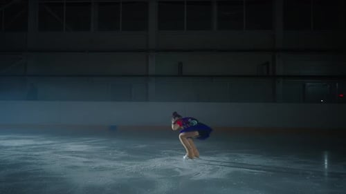 Girl Figure Skating Routine at Indoor Ice Rink