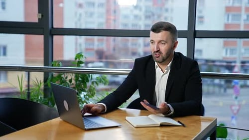 Businessman successful working with laptop in modern office. Handsome man notebook work.
