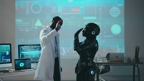 Une équipe réussie d'ingénieurs multiethniques danse avec un prototype de robot cybernétique noir en train de s'amuser