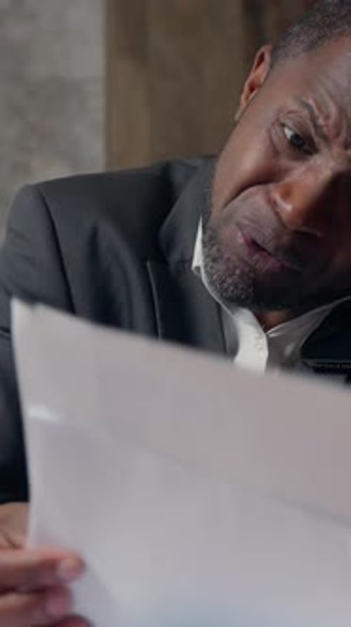 African American Business Man Arguing Phone with Laptop Papers Businessman in Office Irritated Male